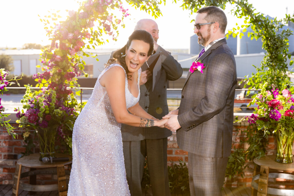 bridge laughing with groom during rooftop ceremony at Prosper Wine House