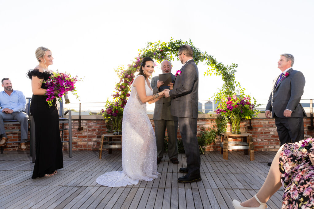 bridge laughing with groom during rooftop ceremony at Prosper Wine House in Prosper