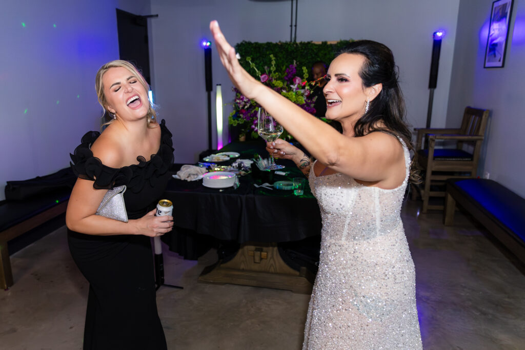 bride and maid of honor dancing