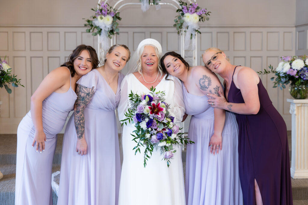 bride standing at the altar with family during vow renewal at The Abbey wedding venue in Justin