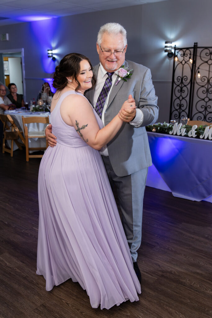 dad and daughter dancing and laughing during wedding reception at The Abbey