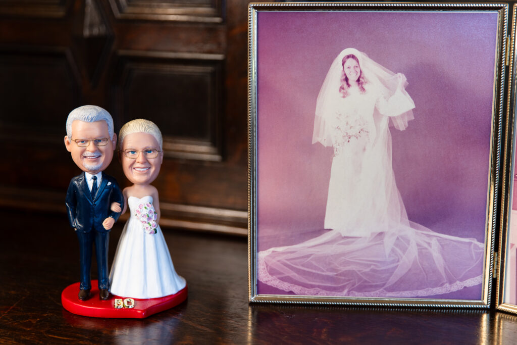 cake topper realistic replica of elderly couple celebrating 50th vow renewal